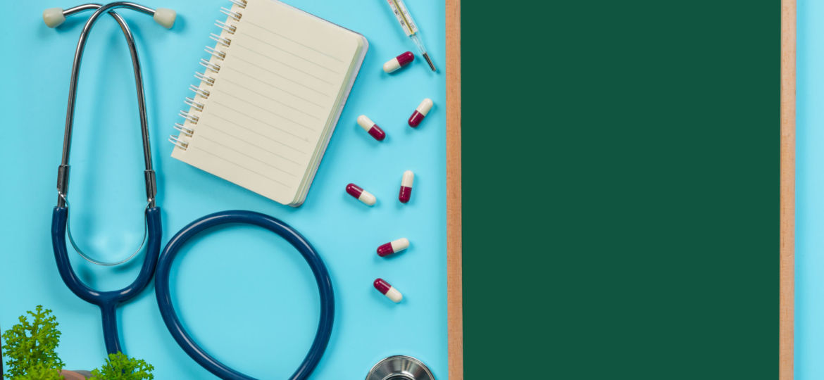 of-medicine-supplies-placed-on-green-board-coupled-with-doctor-tools-on-blue